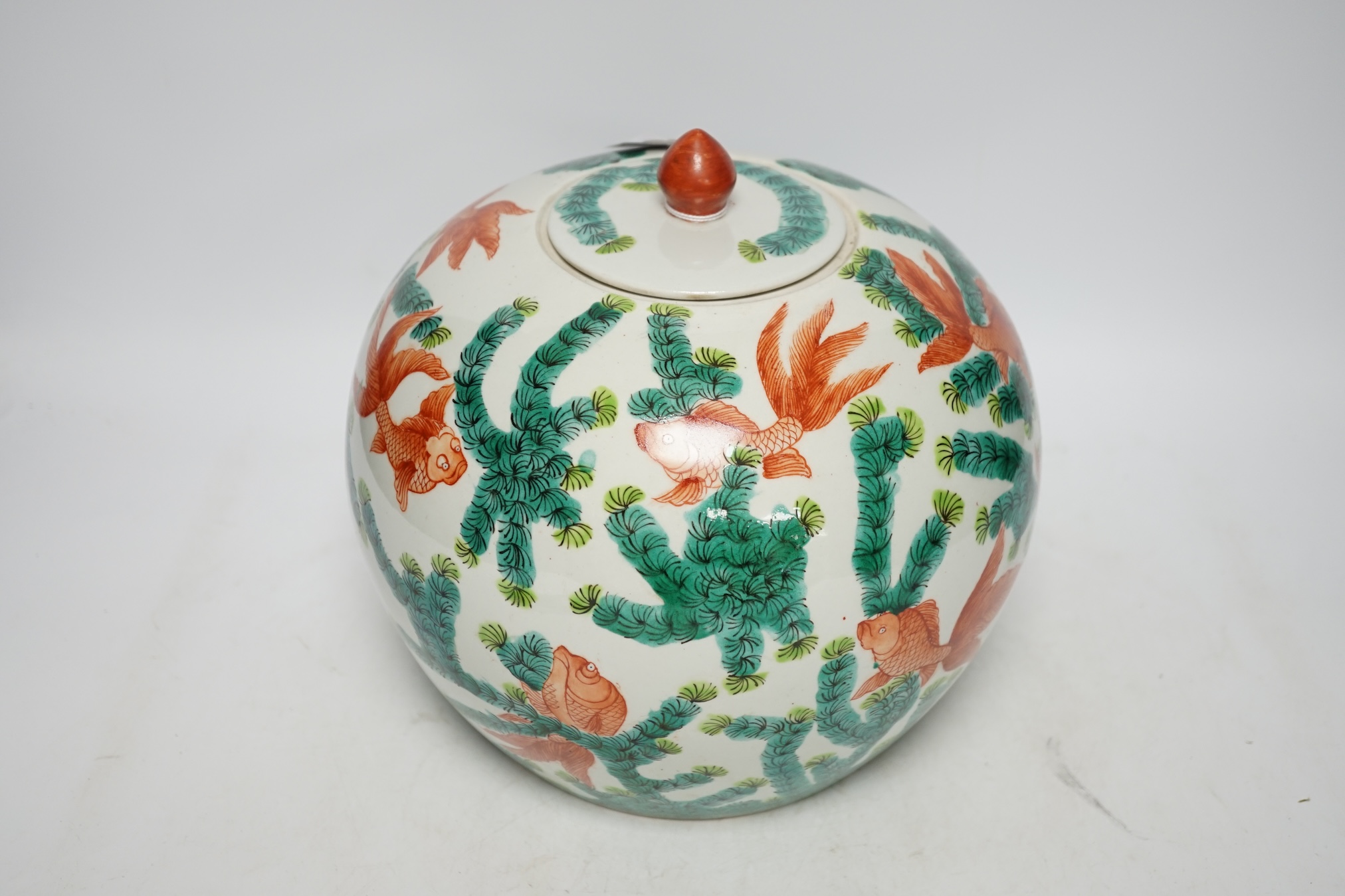 From the Studio of Fred Cuming. A Chinese famille verte goldfish jar and cover, 23cm high. Condition - good